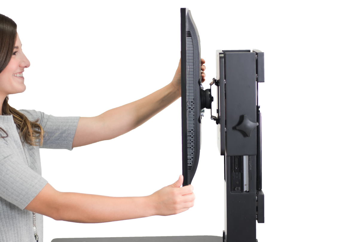 Woman adjusting monitor on high-rise single monitor standing desk