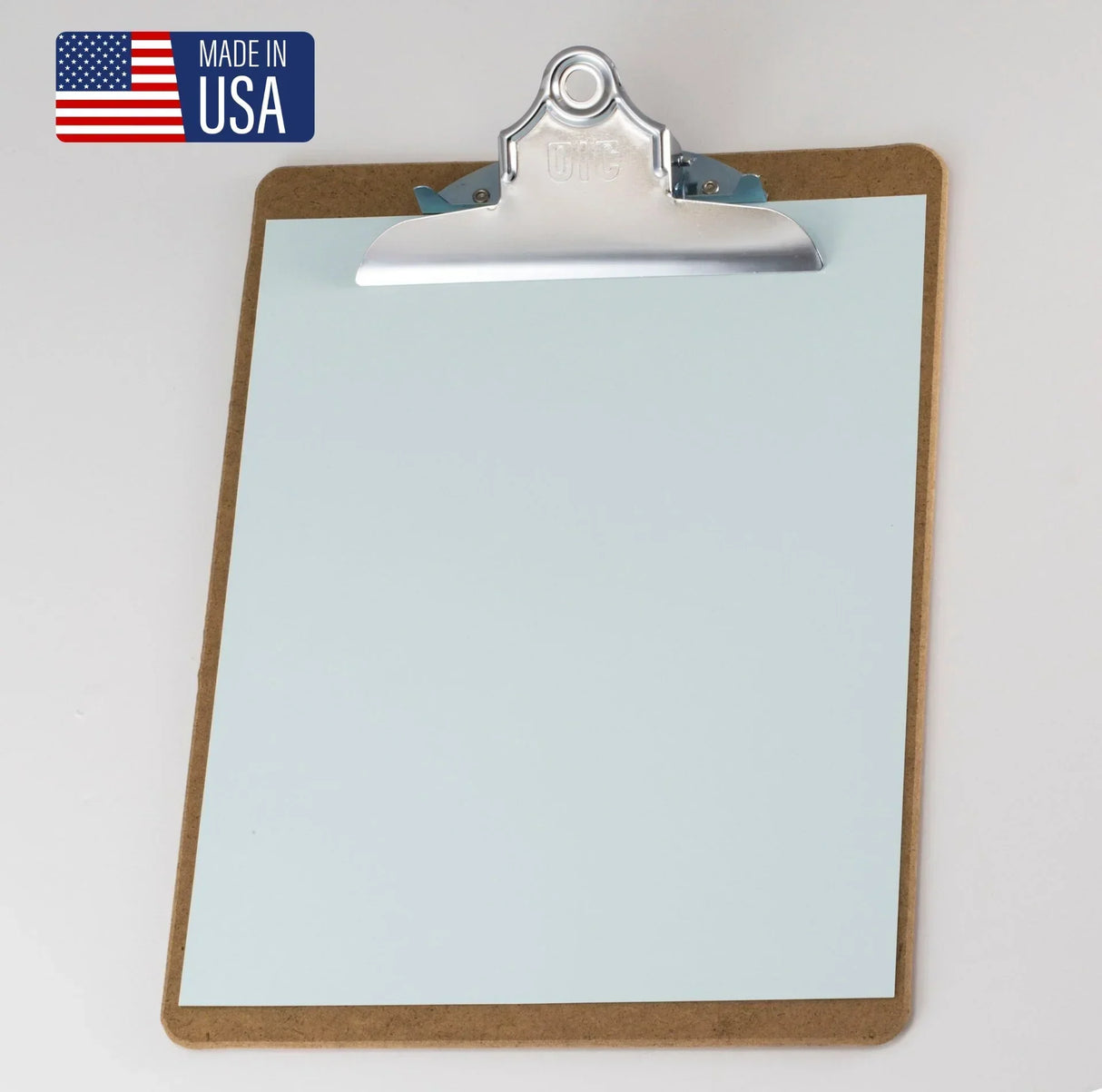 Wood clipboard with metal clip holding blank paper, Made in USA