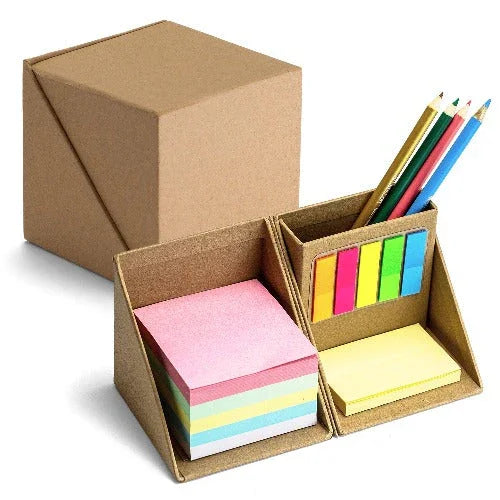 Desk organizer with sticky notes, colored tabs, and pencils in a compact cardboard holder.