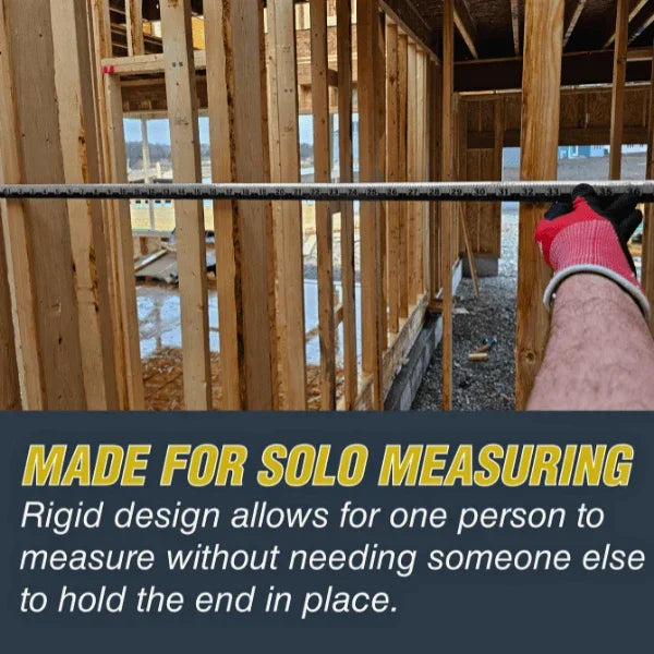 Victor® Zip Stick ProSpan measuring tool used for solo measuring in a wood-framed construction site.