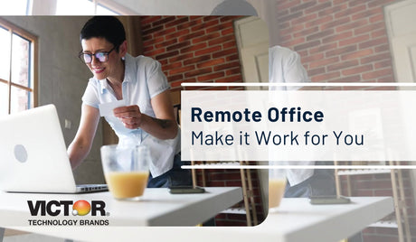 Person working remotely at a modern desk with laptop and office supplies in home office setting