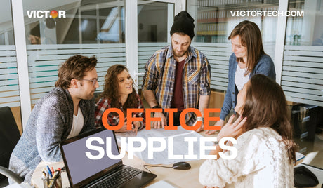 Team collaborating in a modern office with laptops, pens, and office supplies on desk