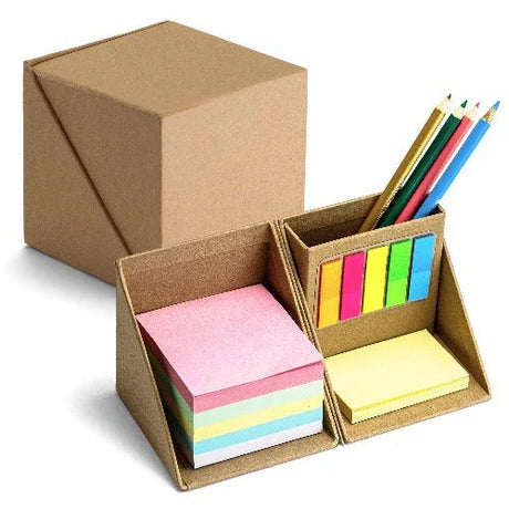 Desk organizer with sticky notes, colored pencils, and index tabs in a foldable brown box
