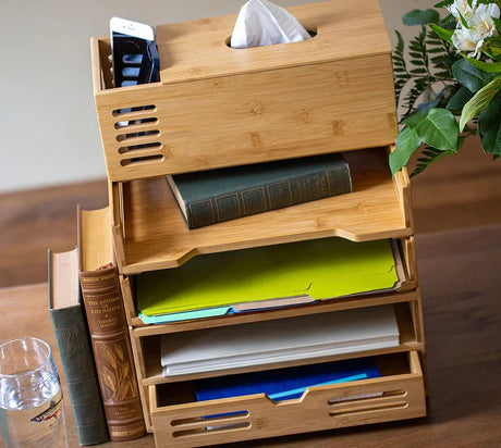 Bamboo desktop organizer with tissue box holder, trays for papers, books, and smartphone, on office desk