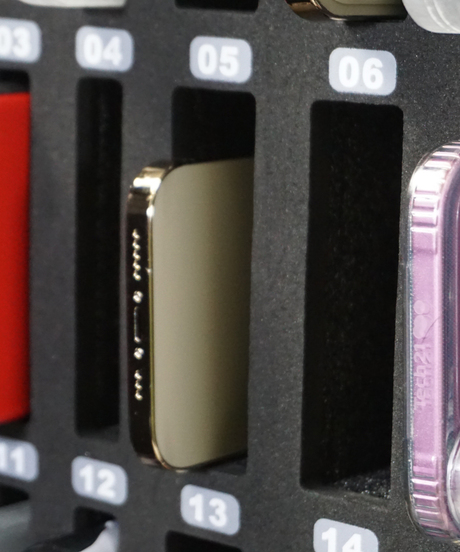 Lockable classroom cell phone storage locker with numbered slots and transparent door