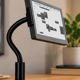 TRMNL 7.5" ePaper Display with a black gooseneck clamp mount on a wooden desk