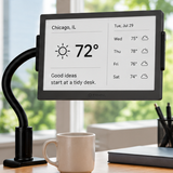 TRMNL 7.5-inch ePaper display on a gooseneck clamp stand on a wooden office desk.