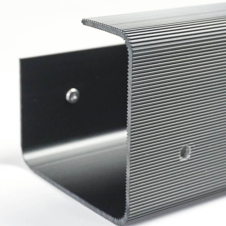 Metallic step with textured surface on a white background
