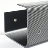 Metallic step with textured surface on a white background