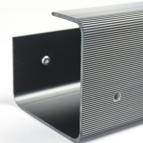 Metallic step with textured surface on a white background