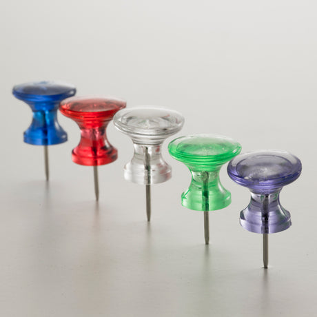 Assorted colored push pins for office or school on a white background