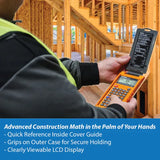 Person using an orange construction calculator with flip cover at a wooden building site