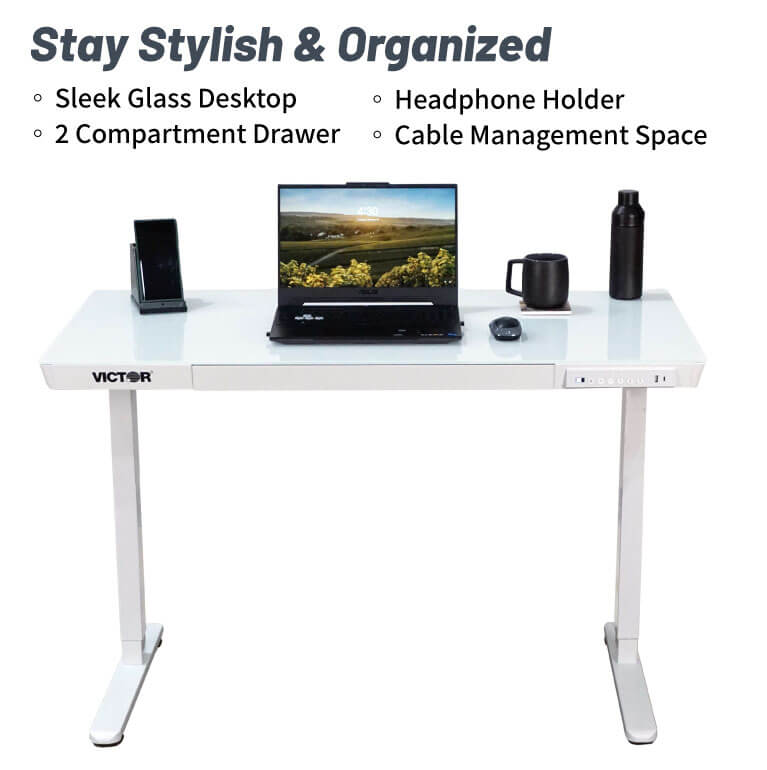 White desk with laptop, phone, and other items on a white background