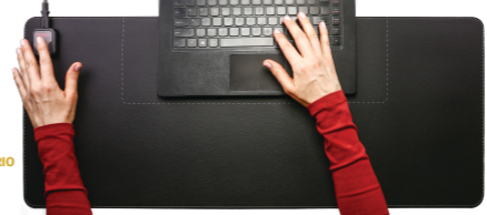 Woman using Heetz heated desk pad