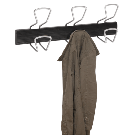 Wall-mounted coat rack with metal hooks holding a green jacket, office organizer