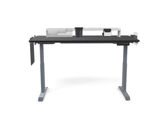 Adjustable standing desk with black tabletop, grey legs, and workspace organizer accessories.