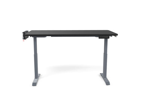Black electric standing desk with adjustable height and digital controls for office workspace