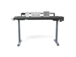 Standing desk with adjustable height and desktop organizers, ideal for office workspace