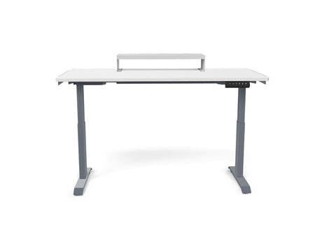 White electric standing desk with raised monitor shelf and digital control panel