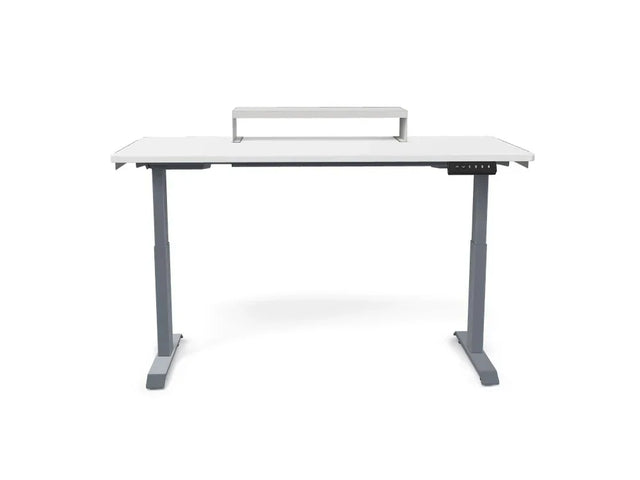 White electric standing desk with raised monitor shelf and digital control panel