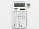 White scientific calculator with digital display and multiple function buttons on a white background.