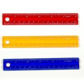 Three colorful Officemate 6-inch rulers in red, yellow, and blue.
