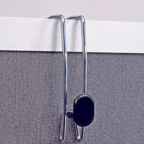 Alba double-sided chrome partition coat hook hanging on a grey office panel