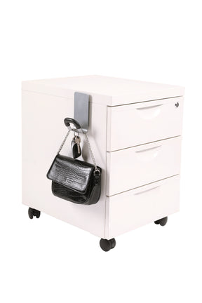 Alba magnetic wall peg with hook holding keys and a small black handbag on a white file cabinet