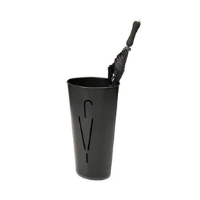 Black Alba oval umbrella stand holding a folded black umbrella