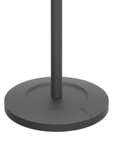 Black circular base and pole of a standing desk, designed for stable workspace solutions.