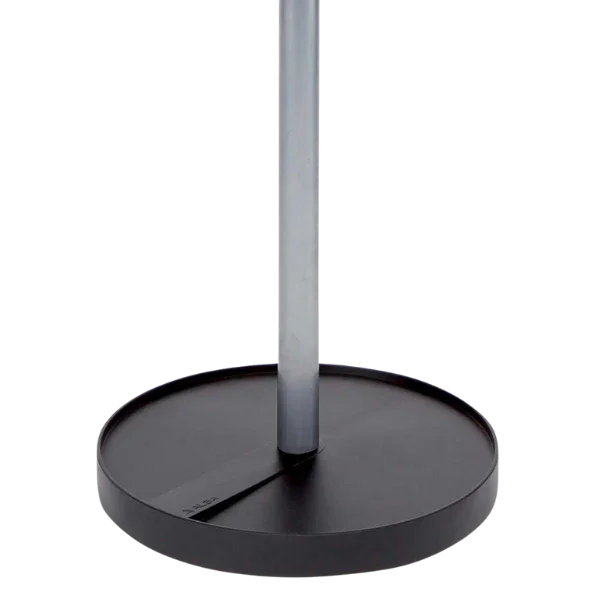 Close-up of a modern coat stand base with a round black platform and silver pole
