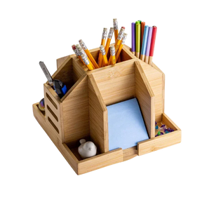 Officemate® Bamboo Rotary Organizer holding pencils, pens, a utility knife, and sticky notes.