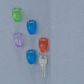 Assorted translucent Officemate Cubicle Hooks in green, blue, purple, and red, one holding a key.