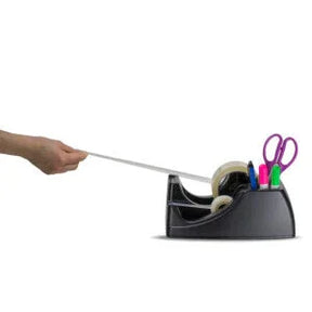 Hand pulling tape from an Officemate Dual Roll Tape Dispenser with built-in pen and scissor holder