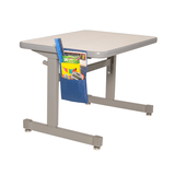 Adjustable height desk with a blue pocket holding school supplies on a white background