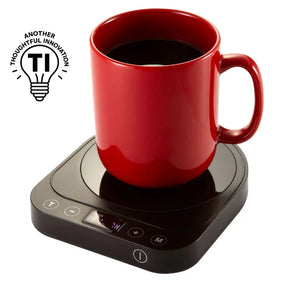 A red coffee mug resting on a Victor® Heetz™ electric cup warmer.