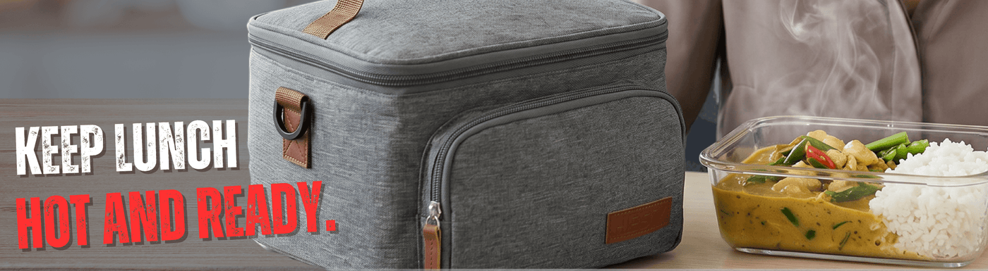 Gray insulated lunch bag with a person holding a container of food on a table.