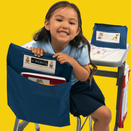 Child sitting on a chair with a blue seat and backrest cover against a yellow background