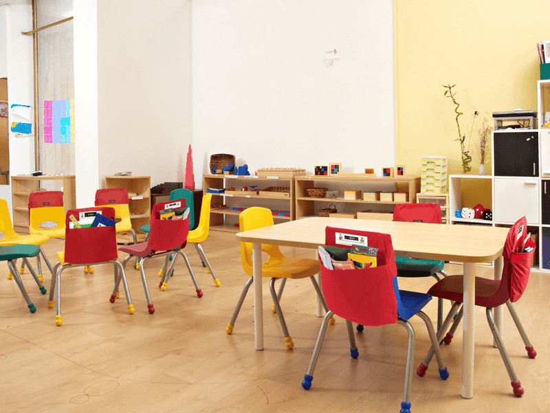 Seat sack with books on a chair in a classroom setting