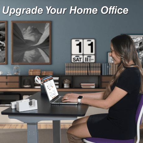 Woman working on a laptop in a home office setting with decorative elements.