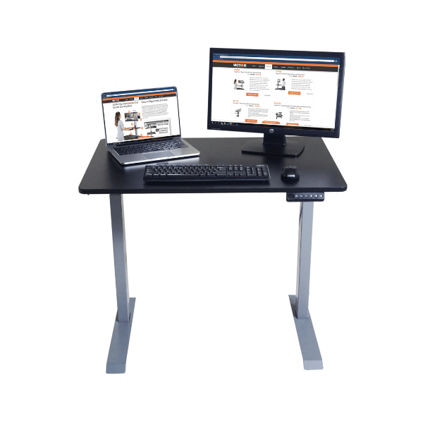 Black adjustable desk with laptop, monitor, and keyboard on a white background