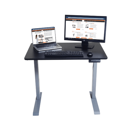 Black adjustable desk with laptop, monitor, and keyboard on a white background