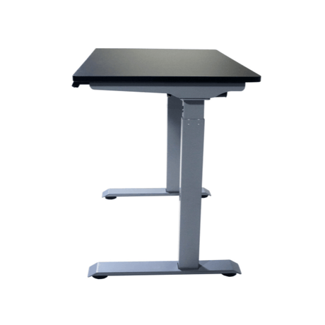 Adjustable height desk with a dark surface on a white background