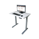 White adjustable desk with computer setup on a white background