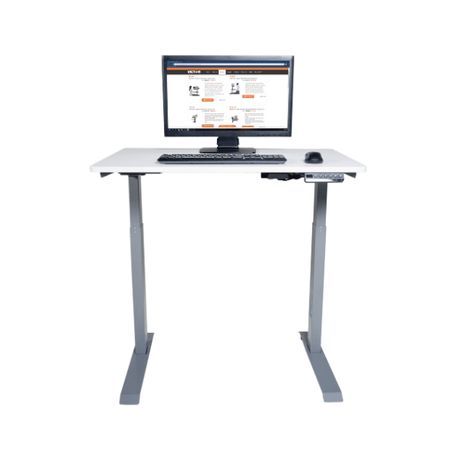 White adjustable desk with computer setup on a white background