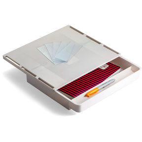 White Officemate® stick-on desk drawer containing a notepad, pen, and sticky notes.