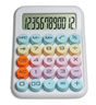 Desktop calculator with pastel round buttons and large digital display showing numbers