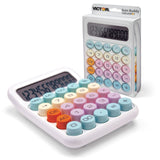 Desktop calculator with colorful round keys and display, shown with packaging.