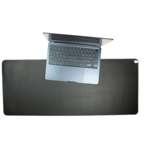Victor® Grounding Desk Pad in black with a silver laptop on top