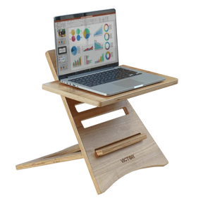 Victor® High Rise™ Acacia Wood Laptop Riser holding a laptop with data charts on screen